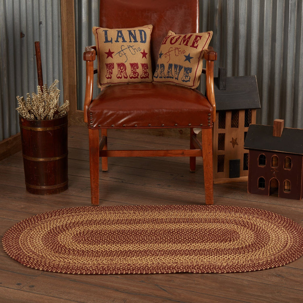 https://www.primitivestarquiltshop.com/cdn/shop/files/Burgundy-Tan-Jute-Rug-Oval-w-Pad-27x48-detailed-image-4_1024x1024.jpg?v=1695833813